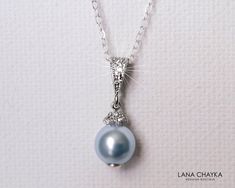 Wedding Swarovski 8mm Light Blue Pearl Drop Pendant with .925 Sterling Silver Chain Bridal Necklace. CHAIN is 18 inches (45.7cm) long. PENDANT is about 0.75 inch (2cm) long including bail. Elegant and timeless, this dainty necklace is perfect for weddings or special occasions such as birthdays, anniversaries, graduations, proms...or whatever you can imagine! Handmade necklace, is made with .925 Sterling Silver 18 inches cable chain, Swarovski 8mm Light Blue round crystal pearl, Rhodium Sterling Elegant Light Blue Necklace For Wedding, Elegant Light Blue Wedding Necklaces, Formal Blue Necklace With Pearl Pendant, Blue Pearl Pendant Jewelry For Wedding, Blue Round Pendant Jewelry For Wedding, Blue Round Pendant Necklace For Wedding, Formal Blue Jewelry With Pearl Pendant, Blue Round Pendant Necklaces For Weddings, Formal Blue Pearl Pendant Jewelry