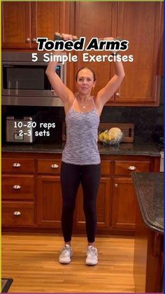 a woman standing in front of a kitchen counter with her arms up and the words toned arms 5 simple exercises