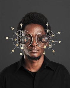 Cyrus Kabiru is a self-taught artist from Kenya that uses found objects to create bold and unusual eyewear sculptures.  "Kabiru has been building his futuristic glasses since childhood, and dedicates much of his time to producing works for his C-Stunner series of eyeglasses and coordinating photographs.  Kabiru’s practice is deeply tied to Afrofuturism, a genre that combines science fiction, magical realism, and historical fiction with the culture and politics of the African diaspora.&qu... Cyrus Kabiru, Eye Sculpture, Futuristic Glasses, Kenyan Artists, Kesha, Futuristic Fashion, Afro Punk, Nairobi, Photographic Paper