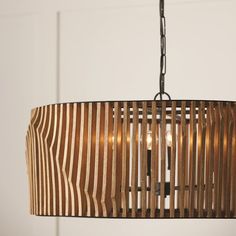 a wooden light fixture hanging from a ceiling