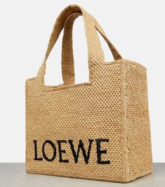 Find LOEWE Paula's Ibiza Raffia Tote Bag on Editorialist. The Loewe Paula's Ibiza Raffia Tote Bag is crafted from woven raffia and features a logo embroidery. It includes an internal slot pocket, top handles, and a detachable, adjustable shoulder strap. It comes with a dust bag. The bag has an open top closure. Loewe Paula's Ibiza, Raffia Tote Bag, Woven Raffia, Bag Crochet, Crochet Bags, Pocket Top, Logo Embroidery, Woven Bag, Open Top