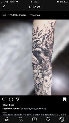 an arm with flowers and birds on it