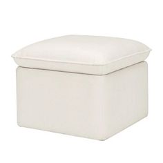 a white ottoman with a cushion on the top and bottom, sitting in front of a white background