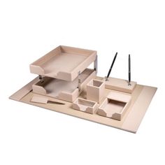 a wooden desk set with two trays and pen holders on top of the table