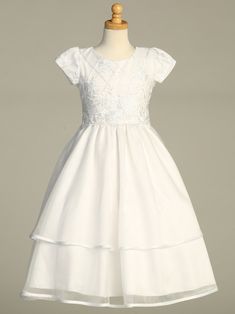 Girls White First Communion Dress w/ Embroidered Tulle & SequinsEmbroidered tulle dress w/ sequinsMade in U.S.A.Acetate Lining (soft)Zip Fastening with bow tieTea LengthDry Clean OnlyAccessories are sold separately- FREE domestic shipping.Inventory changes a lot during communion season (January-May) every effort is made to remove sizes/styles when they sell out. If the size/style you ordered is sold out, we will notify via email or message.