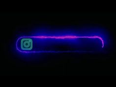 an instagram logo in the dark with neon blue and pink lights on it's side