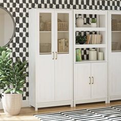 a living room with black and white checkered wallpaper, bookshelves and plants