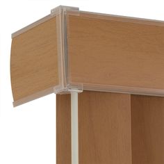 a close up of a wooden shelf with a curtain on the top and bottom half