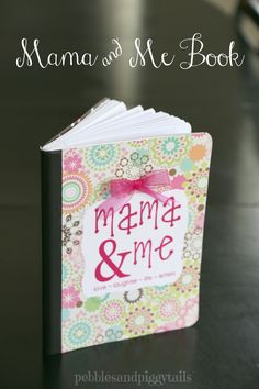 the mama and me book is sitting on a table