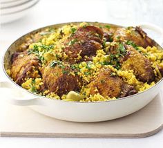 a large pot filled with rice and meat