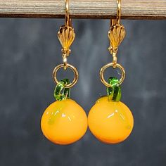 Kawaii so Cute! Orange Fruit Earrings, Glass Citrus Charms, Gold Pierced Earrings * Gold plated brass lever back ear wires * Glass oranges (citrus fruit) * Handmade using vintage glass fruit charms Please see all photos. I have one pair of these earrings. Condition: New, unworn Message me if you have any questions. Ships from California. Yellow Whimsical Dangle Earrings, Whimsical Yellow Dangle Earrings, Fun Orange Dangle Earrings, Fun Orange Earrings As A Gift, Fun Orange Dangle Jewelry, Fun Orange Drop Earrings, Fun Orange Earrings For Gift, Fun Orange Earrings For Gifts, Cute Nickel-free Orange Jewelry