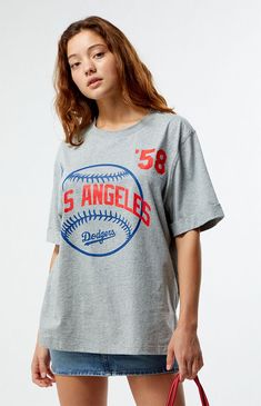 PacSun exclusive! Show off your team spirit with the MLB Wild Collective x PacSun Oversized T-Shirt. This tee features short sleeves, a crew neckline, and a bold baseball team graphic on the front. With its relaxed oversized fit, it’s perfect for a casual day out or cheering from the stands.Solid color teeShort sleevesCrew necklineFront graphicSmall side slitsOversized fit100% cottonMachine washableModel is wearing a size smallModel measurements: 5’6.5” height, 32” bust, 23” waist, 35” hips Womens MLB Wild Collective x PacSun Oversized T-Shirt - Grey size Small Baseball Team, Oversized T Shirt, Team Spirit, Oversized Tshirt, Pacsun, Oversized Fits, Crew Neckline, Mlb, Short Sleeves