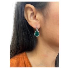 These beautiful emerald & diamond earrings feature 2 emeralds weighing 6.22 cts and diamonds weighing 0.74 cts set in 18k white gold. Formal Pear-shaped Emerald Earrings, Elegant Pear-shaped Emerald Earrings, Elegant Green Diamond Earrings With Brilliant Cut, Green Pear-shaped Earrings For Formal Events, Fine Jewelry Emerald Pear-shaped Earrings, Pear-shaped Emerald Earrings Fine Jewelry, Elegant Green Diamond Earrings, Elegant Green Diamond Earrings In Prong Setting, Elegant Green Diamond Earrings With Prong Setting