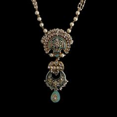 Experience the captivating contrast of blue meenakari work and an ornate barium drop in this stunning piece, bringing it to life with irresistible charm. Pair this necklace with your outfit for a classy and elegant look that is sure to turn heads. Finish: Gold Finish Material: Brass, Kundan, Barium, Pearls Color: Gold, White, Blue Size: One Size Closure Type: Box Lock Box Contains: 1 Necklace Elegant Locket Jewelry For Festivals, Elegant Festival Locket Jewelry, Temple Jewelry With Meenakari Round Pendant, Meenakari Temple Jewelry Round Pendant, Meenakari Round Pendant Temple Jewelry, Elegant Blue Meenakari Necklace, Elegant Blue Kundan Necklace With Intricate Design, Ornate Kundan Necklaces For Festive Occasions, Ornate Meenakari Pendant Jewelry