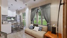 a living room filled with furniture next to a window covered in curtains and drapes