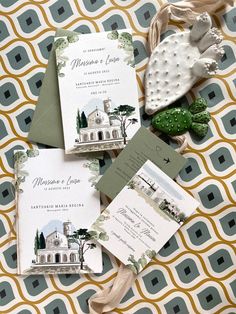 the wedding stationery is laid out on top of each other