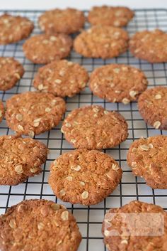 cookies cooling on a wire rack with oatmeal toppings in the middle