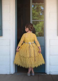 This vintage inspired lace frock is absolutely stunning in person. The color is a dreamy mustard and photographs amazing. The lace is soft, not scratchy and has a French eyelash edging, creating a perfect touch of vintage whimsy. The dress is fully lined with soft cotton and has a back zipper. The daisy floral braided rope belt is completely removable and self ties in back for just the right touch of sweetness. 100% poly self, 100% soft cotton lining. Machine wash, hang dry. Lace Frocks, Girls Fall Dresses, Girls Boutique Clothing, Dress Sash, Online Clothing Boutiques, Dress Belt, Girls Boutique, Toddler Dress