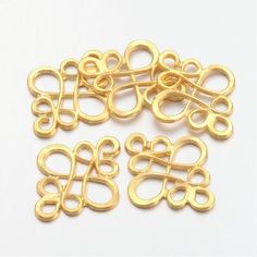 gold plated metal letters and numbers on a white background