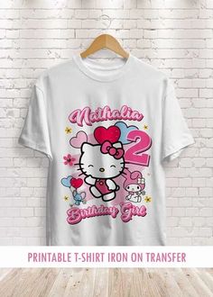 a t - shirt that says, hello kitty birthday girl with pink bow on it