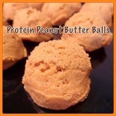 peanut butter balls on a black surface with the words protein peanut butter balls above them