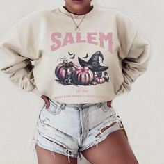 Get into the Halloween spirit with our Salem Witch Sweatshirt! This spooky coquette shirt exudes witchy vibes reminiscent of Salem, Massachusetts. The crewneck design is perfect for staying cozy during the fall pumpkin season. With an oversized fit, this sweater is both stylish and comfortable, making it a must-have for any witchy wardrobe. Printed on super soft and comfortable Gildan 18000 crewneck sweatshirt!  If you would like an oversized look like the pictures shown, please refer to the  me Vintage Halloween Long Sleeve Sweatshirt, Vintage Long Sleeve Halloween Sweatshirt, Oversized Spooky Sweatshirt For Fall, Halloween Goblincore Crew Neck Top, Goblincore Long Sleeve Tops For Fall, Long Sleeve Goblincore Tops For Fall, Oversized Spooky Halloween Sweatshirt, Spooky Oversized Halloween Sweatshirt, Fall Goblincore Tops With Graphic Print