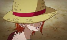 a woman with red hair wearing a straw hat