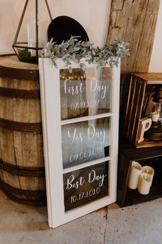 a sign that is on the side of a barrel next to candles and other items