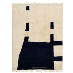 a black and white rug with an abstract design