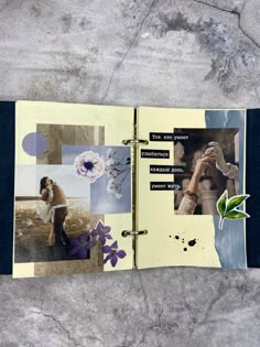 an open scrapbook with pictures and words on it sitting on a concrete floor next to a plant