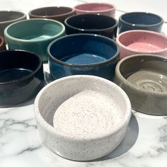 Show your sweet fur-baby some love with these colorful ceramic food/water dishes! *HANDMADE ITEMS ARE UNIQUE AND THEREFORE NO TWO DISHES WILL BE IDENTICAL* Approximate dimensions: *1 Cup: 4.25" diameter, 1.25" height *2 Cup: 4.75" diameter, 1.75" height *If you feed your pet exactly 1 cup of food, I suggest ordering the 2 cup size to allow for some extra space. The 1 cup size easily fits a can of cat food. If you need a bigger size, please click on my shop to see the other listings. (We use the 1 cup size for our rabbits and kittens, and 2 cup for our adult cats) COLORS: *Midnight black sometimes shows some blue where the glaze is thicker, usually on the inside of the dish and the speckles almost appear as stars *Gray is a slightly warm gray *Sunset is mostly red, with oranges and purples Handmade Bowls Pottery, Cat Bowls Ceramic, Cats Colors, Ceramic Cat Bowl, Ceramic Food, Cat Water Bowl, Ceramic Projects, Pottery Inspo, Bowl Pottery