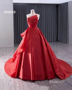 a red ball gown on display in a room