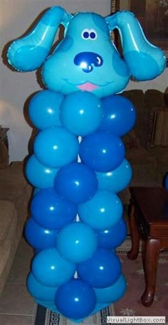 a blue balloon shaped like a dog