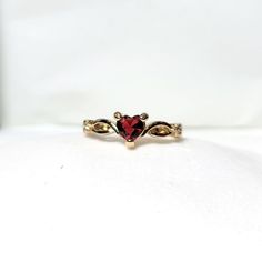 18k Yellow Gold Heart Shaped Ruby July Birthstone Delicate Dainty Ring Size 7 18k Yellow Gold Plated This Ring Is True To Its Beauty!!! The Detail And Sheer Sparkle Is Absolutely Stunning!! Wear Your Heart On Your Finger, Or Gift This To The Love Of Your Life! This Heart Shaped Solitaire Gemstone Sits Pretty On A 18k Yellow Gold Plated Band. This Lab Created Ruby Is A Shiny Red Gem Teeming With Fire And Brilliance. #Goldplated #Ringsize7 #Size7ring #Julybirthstone #Ruby Red Fashion Gold Plated H Heart Shaped Gold Ring, Gold And Red Wedding Ring, Red Gold Ring, Gold And Ruby Jewelry, Gold Ring Red Stone, Gold Ruby Ring For Valentine's Day, Gold Heart Ring With Gemstone In Fine Jewelry Style, Fine Jewelry Gold Heart Ring With Gemstone, Gold Ruby Ring For Promise Occasion