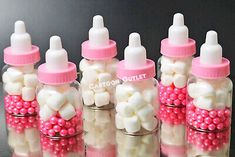 small bottles filled with white and pink candies