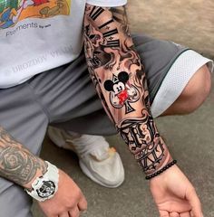 a man with a tattoo on his arm