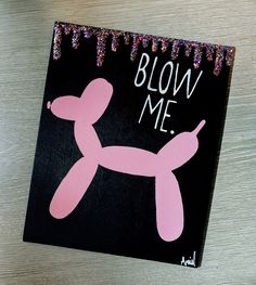 a pink balloon dog on a black background with the words blow me painted on it