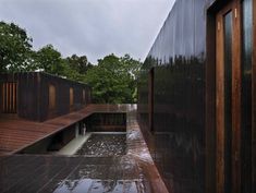 an outdoor area with wooden floors and walls