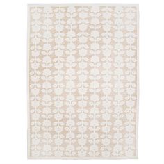 a beige and white rug with an intricate design on the bottom, in front of a white background