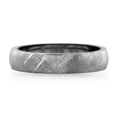 a men's wedding band with an etched design