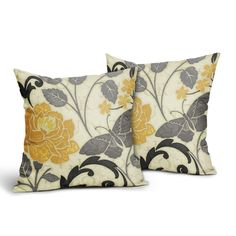 two decorative pillows with yellow flowers on them