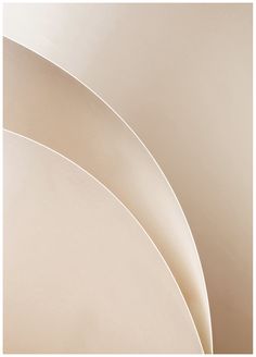 an abstract photograph of curved white walls