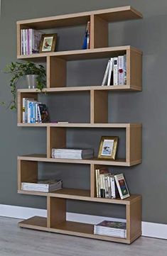 the bookshelf is made out of wood and has several shelves on each side