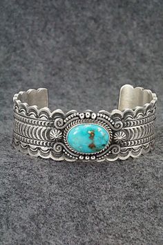 This stunning Kingman turquoise and sterling silver bracelet featuring a scalloped edge cuff was made by Navajo silversmith Michael Calladitto. The inside is signed M&R Calladitto and stamped Sterling.Size: 5 3/4" (will fit up to a 7 1/8" wrist)Gap: 1 3/8"Width: 1"Free shipping on all orders! We ship with USPS and always include tracking. All orders ship within a day of payment.Returns are accepted up to 30 days after you receive your order. Just send us a message. Our shop offers cash back or s M R, Kingman Turquoise, Sterling Silver Bracelet, Holiday Sales, Scalloped Edge, Turquoise Sterling Silver, Sterling Silver Bracelets, Silver Bracelet, Jewelry Watches