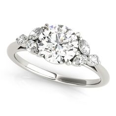 a diamond ring with three stones on the side