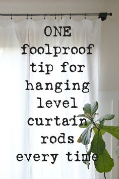 a white curtain with the words one foolproof tip for hanging level curtain rods every time