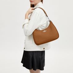 Inspired by the relaxed style of classic hobo silhouettes our Teri Hobo Bag is the perfect size to wear comfortably every day (while still carrying all your necessities). Crafted of refined pebble leather this leather hobo bag fits your essentials—phone keys and wallet—and keeps them secure with a zip closure. You can wear this pebbled leather crossbody bag two ways thanks to a detachable handle and strap that make it extra versatile. For added organization there’s even an outside zip pocket and Classic On-the-go Baguette Bag, Coach Teri Hobo Bag, Classic Textured Leather Baguette Bag For Everyday, Classic Textured Leather Baguette Bag, Coach Outlet, Leather Hobo Bag, Leather Hobo, Relaxed Style, Pebbled Leather