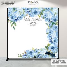 a wedding sign with blue flowers on it