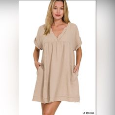 New Boutique Item Zenana Light Mocha Rolled Short Sleeve Raw Edge V-Neck Dress This Light Mocha V-Neck Dress Is The Epitome Of Comfort And Style. Its Short Sleeves And Raw Edge Detailing Add A Cute And Trendy Touch To Its Neutral Color, Making It The Perfect Choice For Any Spring Event. Stay Comfortable And Stylish All Day Long With This Must-Have Dress. Fabric Content: 100% Cotton Casual Mini Dress With Split Neck For Brunch, Casual Khaki Beach Dress, Casual Taupe Dress For Brunch, Casual Taupe Midi Dress For Summer, Taupe Spring Dress For A Day Out, Taupe Dress For Spring Day Out, Taupe Dresses For Spring Day Out, Casual Neutral Dress For Vacation, Casual Khaki Dress For Brunch