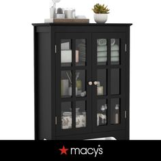 a black cabinet with glass doors and shelves